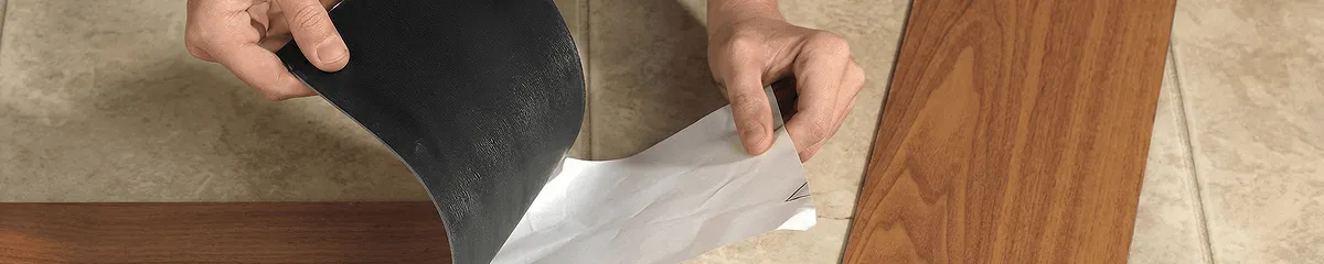A professional installing vinyl flooring in Dover, DE